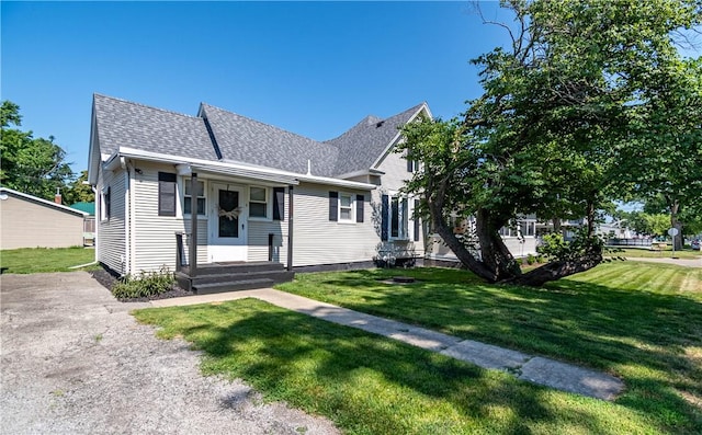 503 W Harrison St, Sullivan, IL 61951 - view of front of house with a front yard and roof with shingles