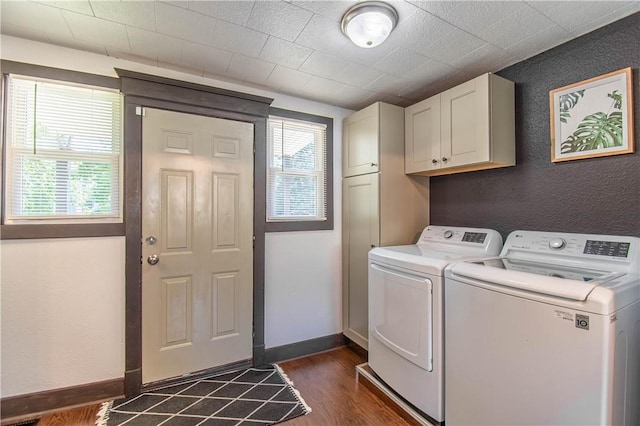 503 W Harrison St, Sullivan, IL 61951 - laundry area with cabinet space, washing machine and clothes dryer, dark wood-style flooring, and a textured wall