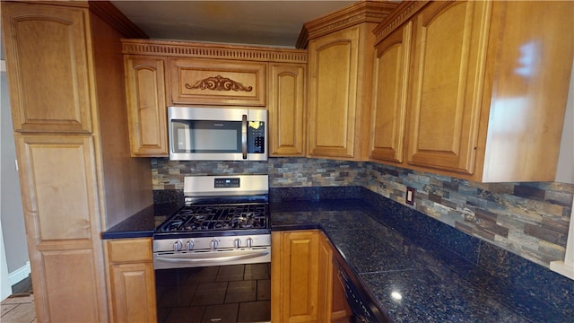 kitchen featuring appliances with stainless steel finishes and backsplash