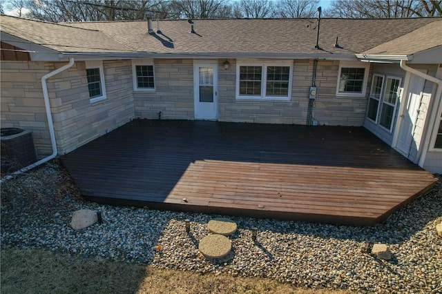 wooden terrace featuring central AC unit