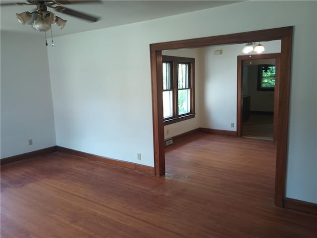 920 Garfield Pl, Danville, IL 61832 - empty room with wood finished floors, ceiling fan, and healthy amount of natural light