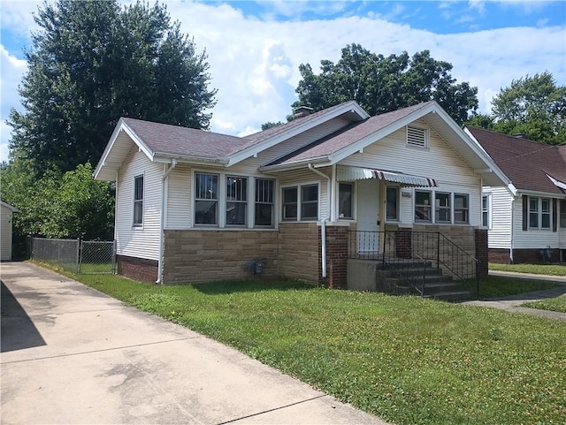 920 Garfield Pl, Danville, IL 61832 - view of front of home with stone siding, a chimney, and roof with shingles