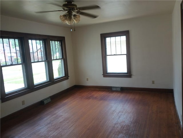 920 Garfield Pl, Danville, IL 61832 - empty room with dark wood finished floors and a ceiling fan