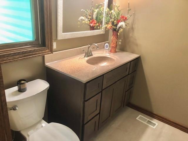 1110 S 2nd St, Effingham, IL 62401 - bathroom featuring vanity and toilet