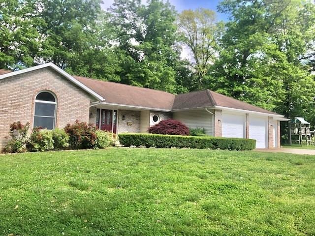 1110 S 2nd St, Effingham, IL 62401 - single story home featuring brick siding, a garage, and a front lawn
