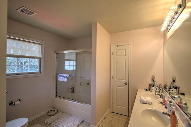 737 Phillip Cir, Forsyth, IL 62535 - full bathroom with double vanity and combined bath / shower with glass door