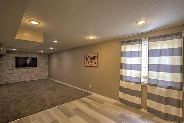 737 Phillip Cir, Forsyth, IL 62535 - unfurnished living room featuring a textured ceiling, wood finished floors, and recessed lighting