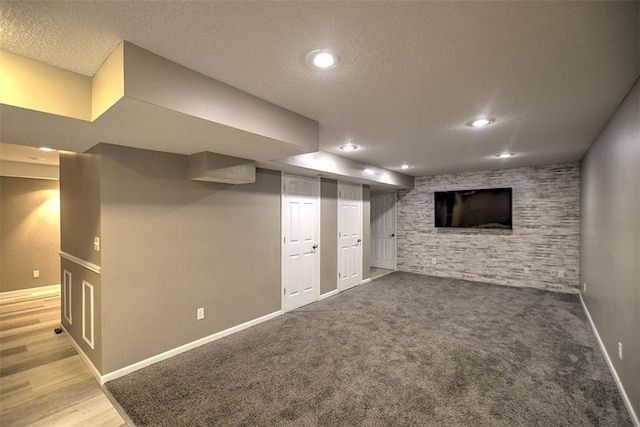 737 Phillip Cir, Forsyth, IL 62535 - finished below grade area with a textured ceiling, recessed lighting, and carpet flooring