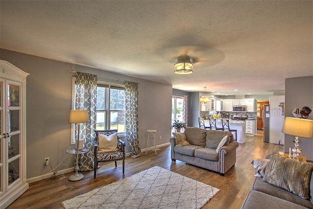 737 Phillip Cir, Forsyth, IL 62535 - living room featuring dark wood-style flooring and ceiling fan