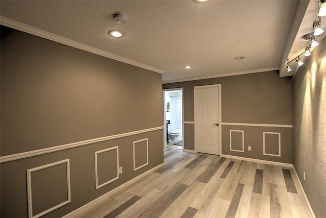 737 Phillip Cir, Forsyth, IL 62535 - unfurnished room with a textured ceiling, ornamental molding, light wood finished floors, recessed lighting, and a smoke detector