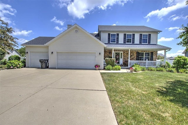 737 Phillip Cir, Forsyth, IL 62535 - view of front facade with a porch, a garage, a front lawn, driveway, and roof with shingles