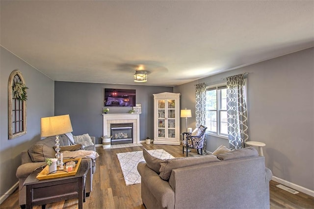 737 Phillip Cir, Forsyth, IL 62535 - living area with a tiled fireplace and wood finished floors