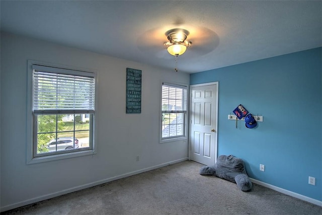 737 Phillip Cir, Forsyth, IL 62535 - carpeted spare room with a ceiling fan and baseboards