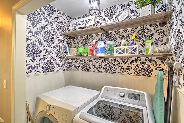 737 Phillip Cir, Forsyth, IL 62535 - laundry area with wallpapered walls, washing machine and clothes dryer, and a wainscoted wall