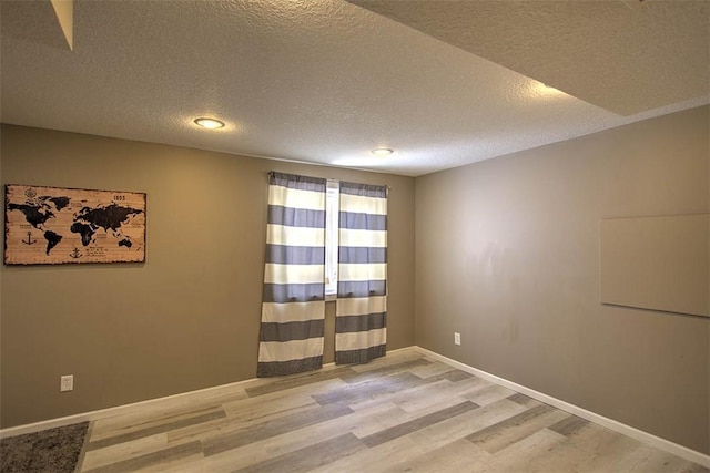 737 Phillip Cir, Forsyth, IL 62535 - empty room with wood finished floors and a textured ceiling