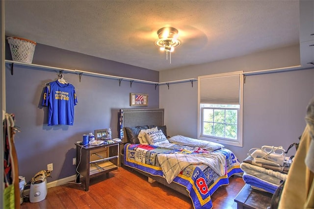 737 Phillip Cir, Forsyth, IL 62535 - bedroom featuring wood finished floors and a textured ceiling