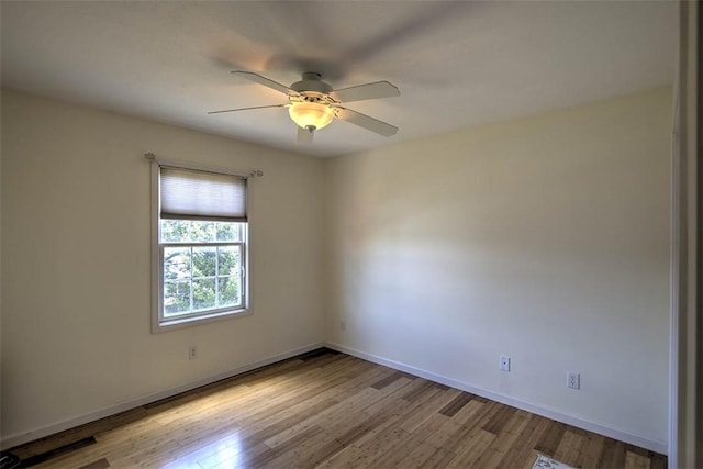 737 Phillip Cir, Forsyth, IL 62535 - spare room with wood finished floors and ceiling fan