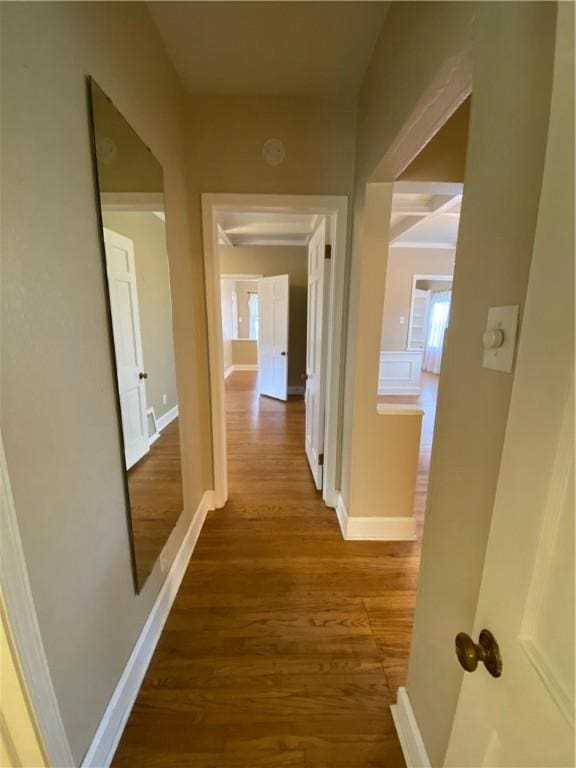 corridor with wood-type flooring