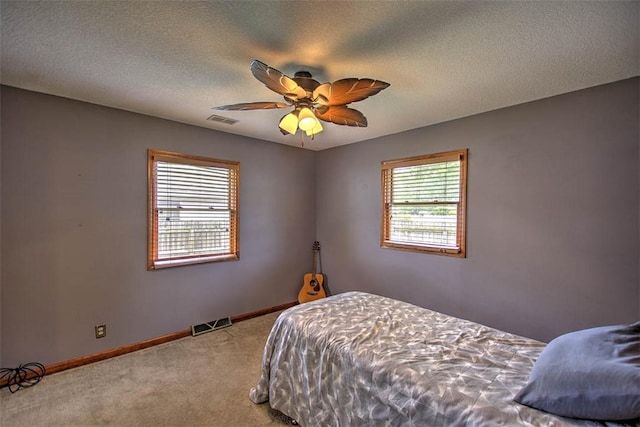 335 E Walnut St, Dalton City, IL 61925 - bedroom featuring carpet floors, baseboards, a textured ceiling, and ceiling fan