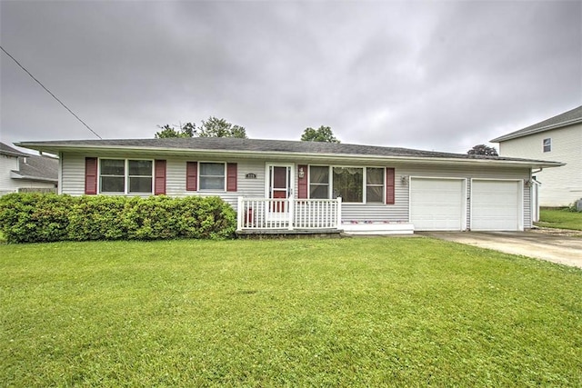 335 E Walnut St, Dalton City, IL 61925 - view of front of property with an attached garage, concrete driveway, and a front yard