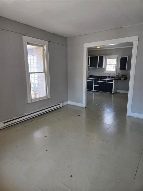 spare room featuring baseboards and baseboard heating