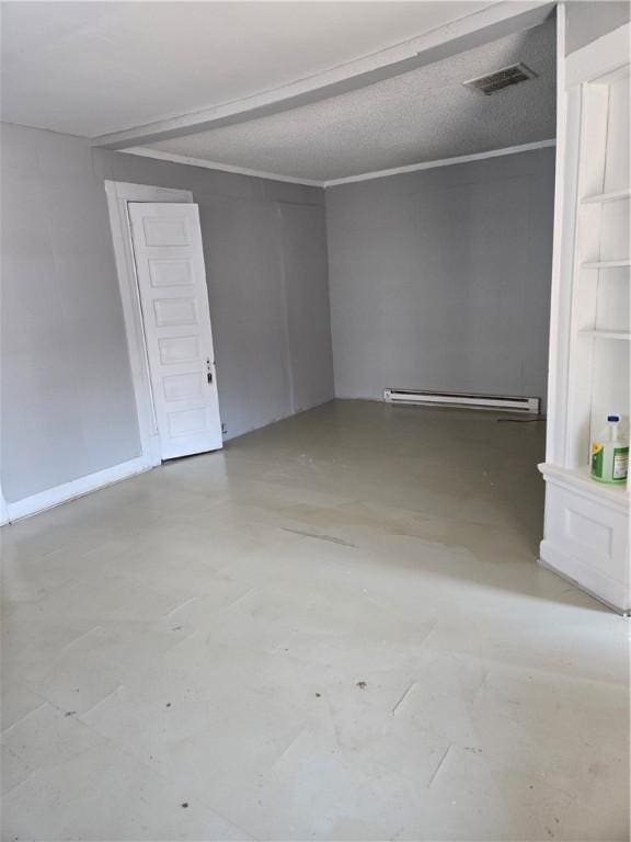 unfurnished room with a baseboard heating unit, visible vents, crown molding, and a textured ceiling