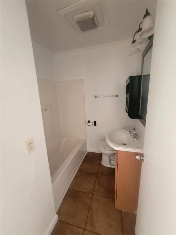 full bathroom with toilet, vanity, baseboards, ornamental molding, and tile patterned floors