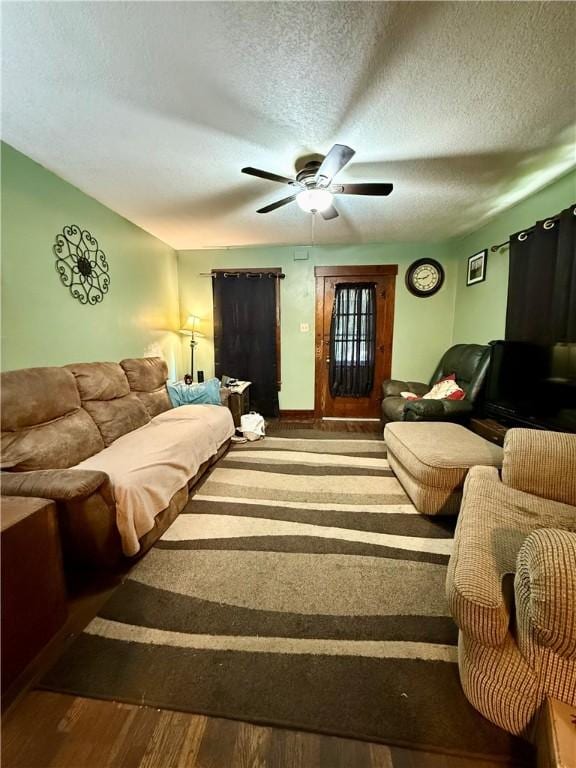 124 Polk Ave, Charleston, IL 61920 - living area featuring wood finished floors, a ceiling fan, and a textured ceiling