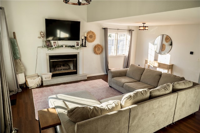 living room with dark hardwood / wood-style flooring