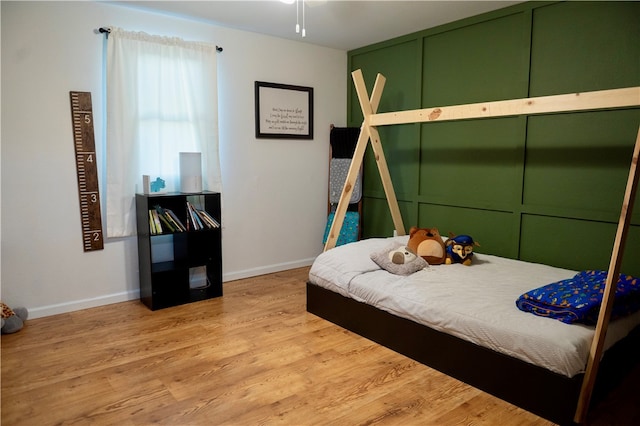 bedroom with light hardwood / wood-style floors