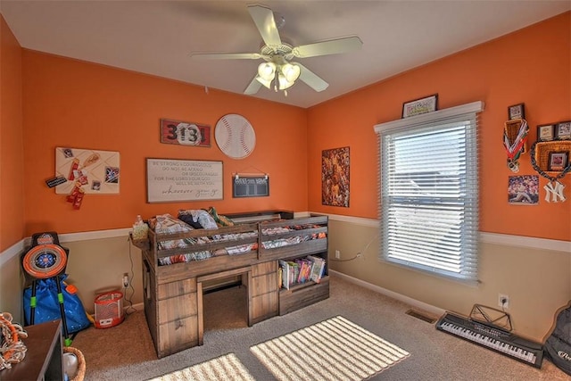 bedroom with ceiling fan and carpet floors