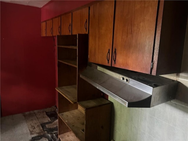 705 Orlando Dr, Robinson, IL 62454 - kitchen with under cabinet range hood and brown cabinetry