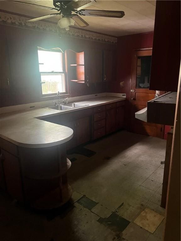 705 Orlando Dr, Robinson, IL 62454 - kitchen with a ceiling fan, tile patterned floors, a peninsula, and light countertops