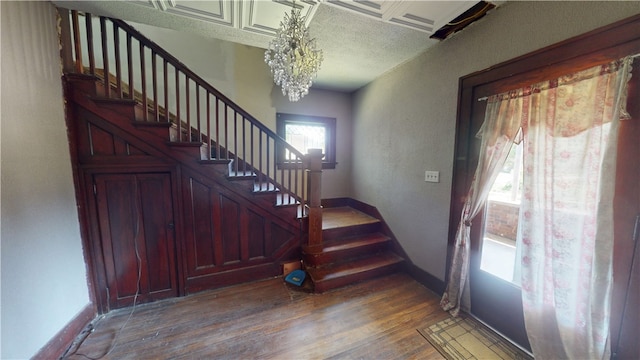 616 Griffin St, Danville, IL 61832 - foyer with stairs, wood finished floors, and a chandelier