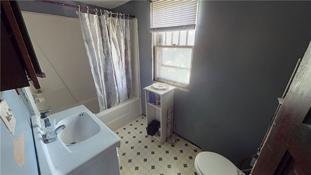 616 Griffin St, Danville, IL 61832 - bathroom featuring tile patterned floors, vanity, and shower / bath combo with shower curtain