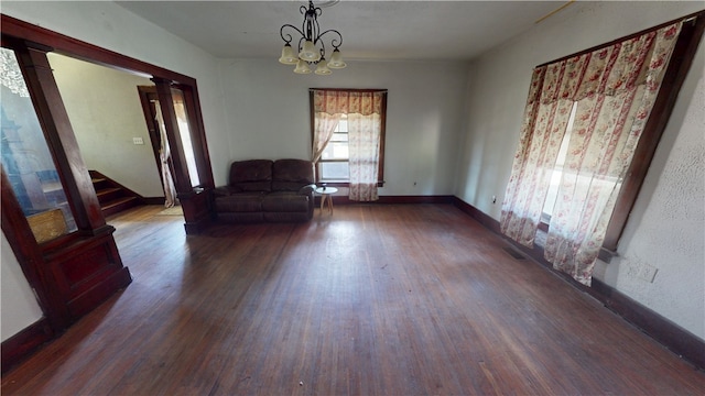616 Griffin St, Danville, IL 61832 - sitting room featuring wood finished floors, a chandelier, stairs, and ornate columns