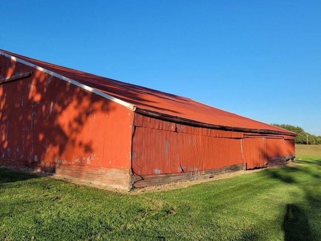 view of outdoor structure with a lawn