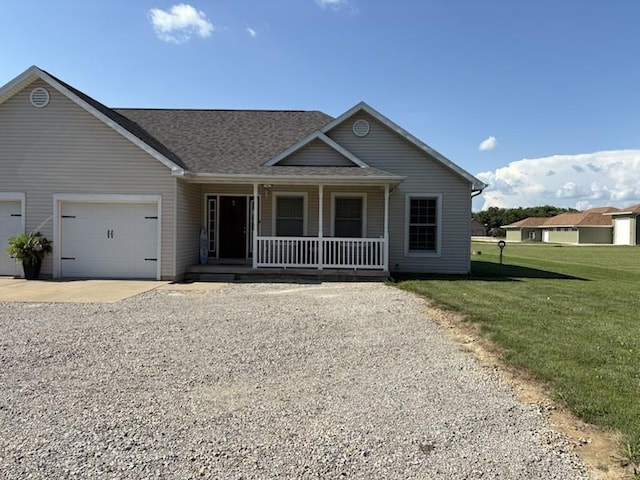 34A Woolery Dr, Neoga, IL 62447 - view of front of house featuring a porch, an attached garage, driveway, a front yard, and a shingled roof