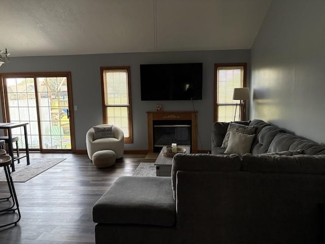 34A Woolery Dr, Neoga, IL 62447 - living room featuring lofted ceiling, wood finished floors, and a glass covered fireplace