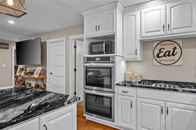 25760 E 1750th Rd, Marshall, IL 62441 - kitchen with appliances with stainless steel finishes, dark stone countertops, white cabinetry, light wood-type flooring, and recessed lighting