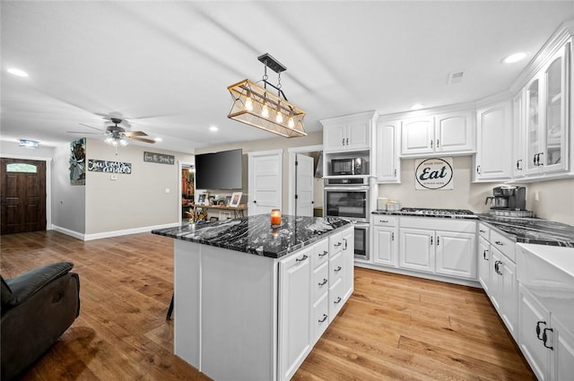 25760 E 1750th Rd, Marshall, IL 62441 - kitchen featuring open floor plan, stainless steel appliances, recessed lighting, glass insert cabinets, and a kitchen island