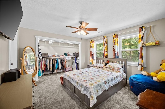 25760 E 1750th Rd, Marshall, IL 62441 - carpeted bedroom featuring a closet, a textured ceiling, and a ceiling fan