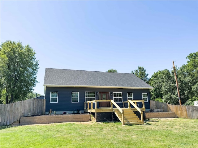 view of front of house featuring a front yard and a deck