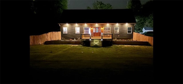 view of back house at night