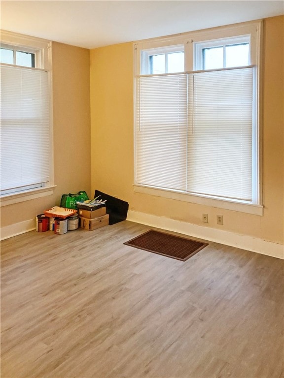 rec room with hardwood / wood-style floors