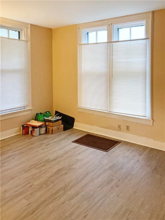 1009 S 14th St, Mattoon, IL 61938 - unfurnished room featuring wood finished floors and baseboards