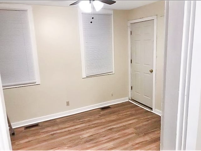 unfurnished room featuring wood-type flooring and ceiling fan