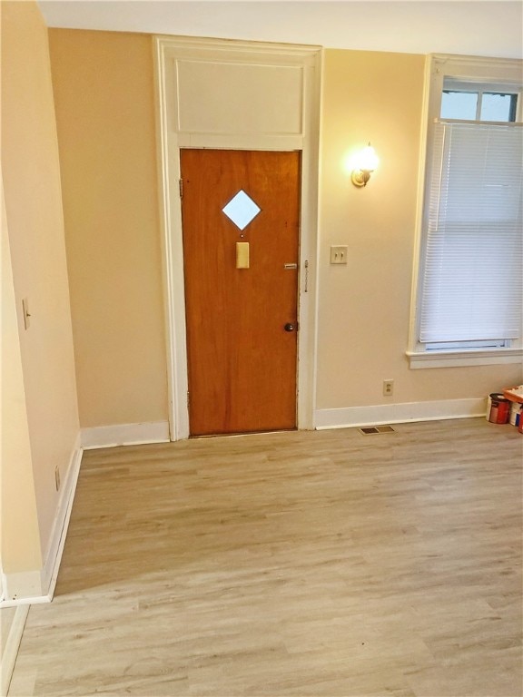 foyer entrance featuring light wood-type flooring