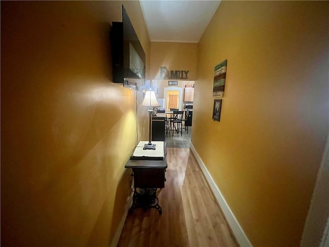 720 Prairie Ave, Mattoon, IL 61938 - corridor featuring light wood finished floors and baseboards