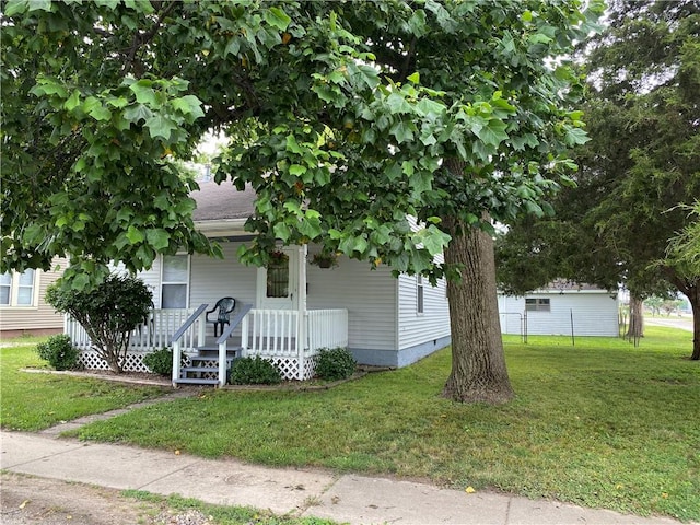 102 10th St, Charleston, IL 61920 - view of front of property featuring a porch, a front lawn, and crawl space